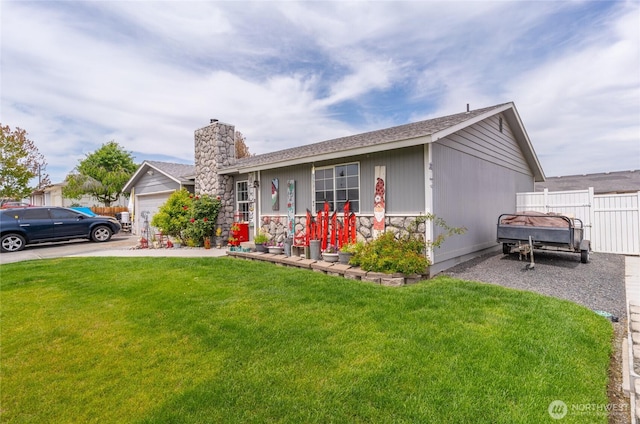 327 N Grape Dr, Moses Lake, WA 98837 - single story home featuring a chimney, driveway, a shingled roof, an attached garage, and stone siding