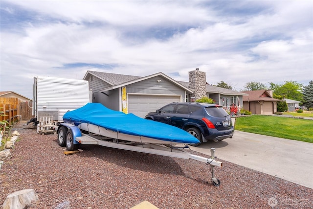 327 N Grape Dr, Moses Lake, WA 98837 - view of front of property with an attached garage and concrete driveway
