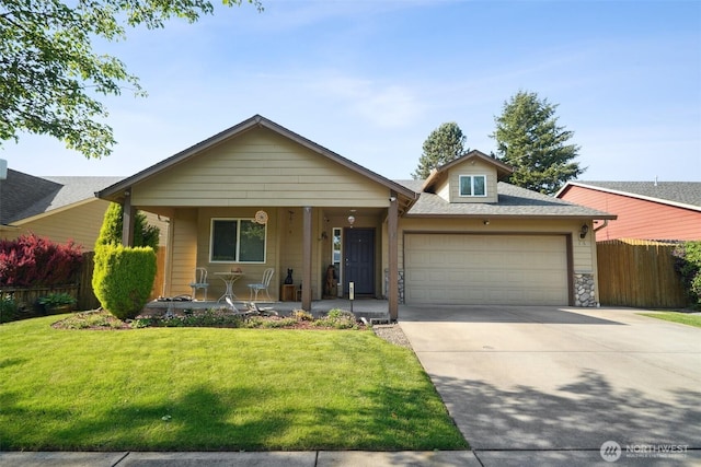 16 NW 23rd St, Battle Ground, WA 98604 - view of front facade featuring covered porch, an attached garage, concrete driveway, and roof with shingles