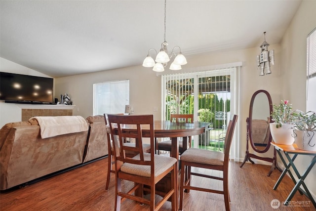 16 NW 23rd St, Battle Ground, WA 98604 - dining room with a chandelier, plenty of natural light, wood finished floors, and vaulted ceiling