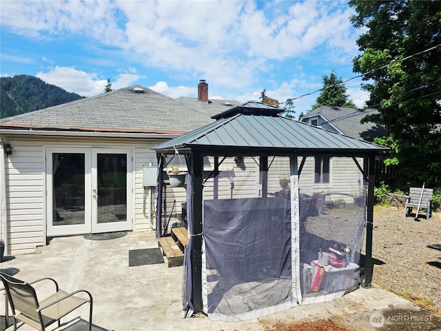 591 Division Ave, Morton, WA 98356 - rear view of property featuring a gazebo, french doors, a patio area, and a chimney