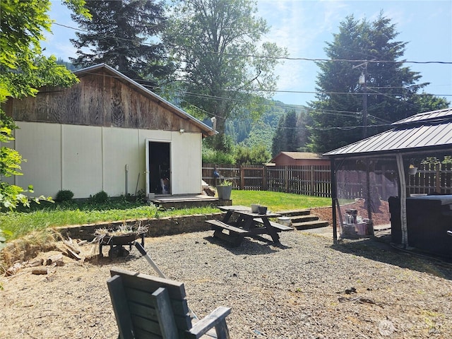 591 Division Ave, Morton, WA 98356 - view of yard with a fire pit and a gazebo