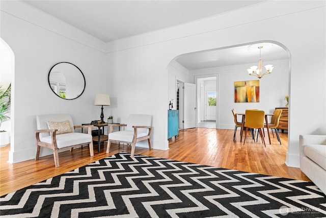 1584 Main St, Lynden, WA 98264 - sitting room with arched walkways, light wood-type flooring, and a chandelier