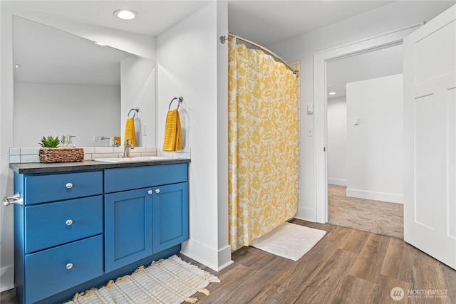 1584 Main St, Lynden, WA 98264 - bathroom featuring vanity, wood finished floors, a shower with curtain, and recessed lighting