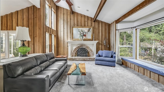 12350 SE 96th Pl, Renton, WA 98056 - carpeted living room featuring wooden walls, a ceiling fan, and a fireplace