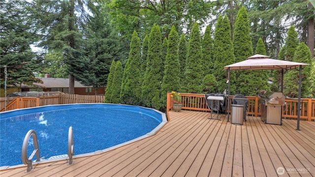 12350 SE 96th Pl, Renton, WA 98056 - view of pool with a gazebo, a wooden deck, and a grill
