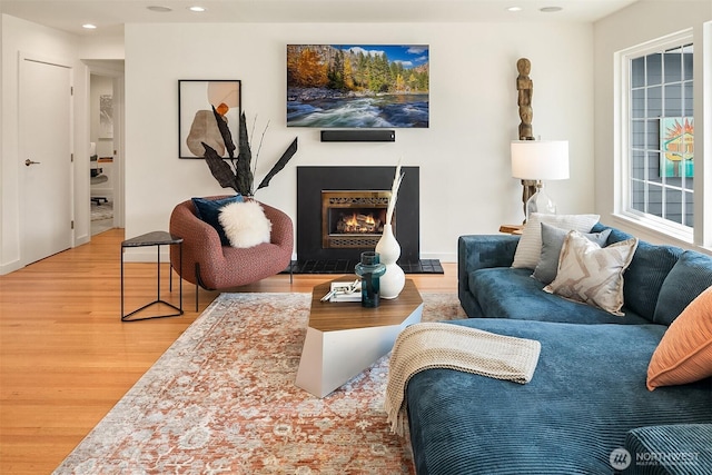 527 16th Ave W, Kirkland, WA 98033 - living room with wood finished floors, recessed lighting, and a warm lit fireplace