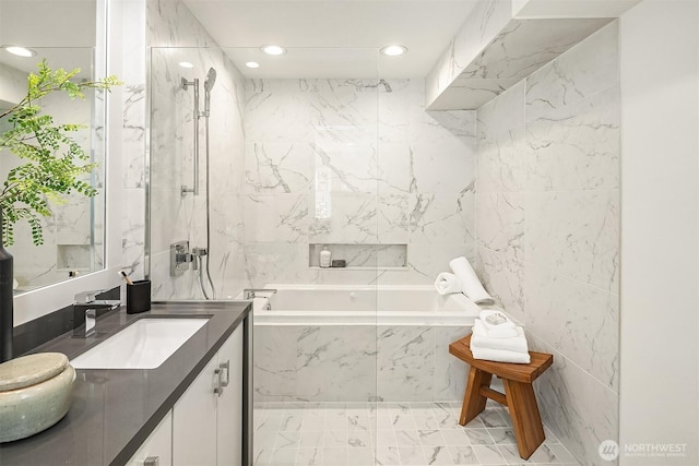 527 16th Ave W, Kirkland, WA 98033 - bathroom with vanity, a garden tub, recessed lighting, marble finish floors, and tile walls