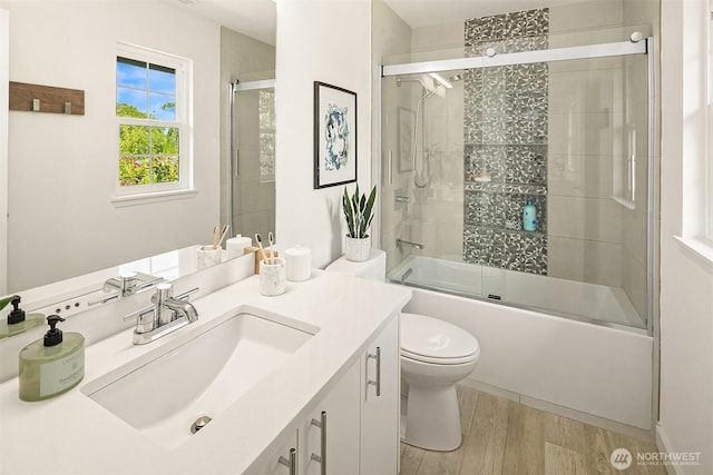 527 16th Ave W, Kirkland, WA 98033 - full bathroom featuring vanity, wood finished floors, and combined bath / shower with glass door