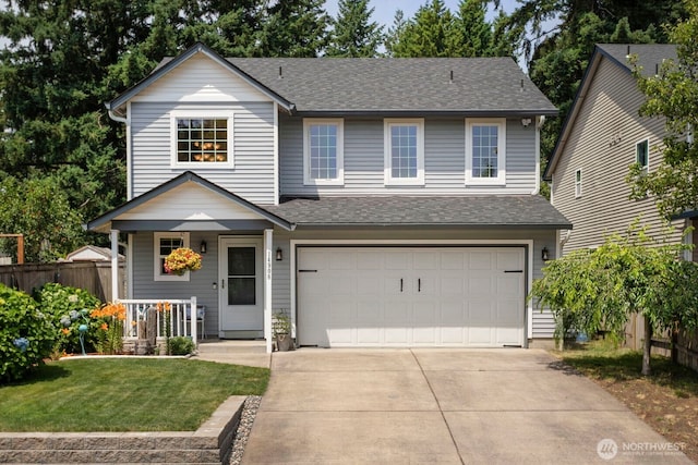 14908 NE 70th St, Vancouver, WA 98682 - view of front of house with a garage, a porch, concrete driveway, and roof with shingles
