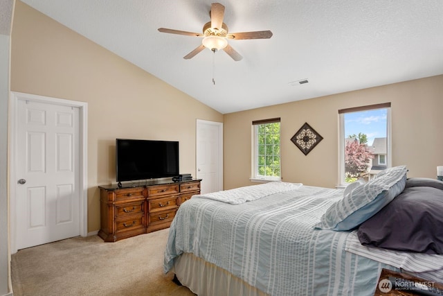 14908 NE 70th St, Vancouver, WA 98682 - bedroom with light carpet, vaulted ceiling, and a ceiling fan