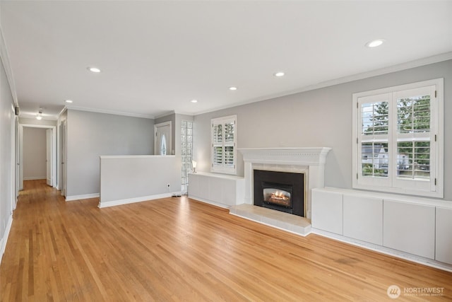806 SW 126th St, Seattle, WA 98146 - unfurnished living room with crown molding, light wood-style flooring, recessed lighting, and a fireplace