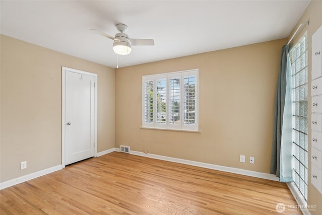 806 SW 126th St, Seattle, WA 98146 - unfurnished bedroom with light wood-type flooring, multiple windows, and a ceiling fan