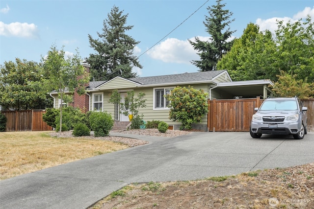806 SW 126th St, Seattle, WA 98146 - view of front facade with concrete driveway, a chimney, a carport, and a shingled roof