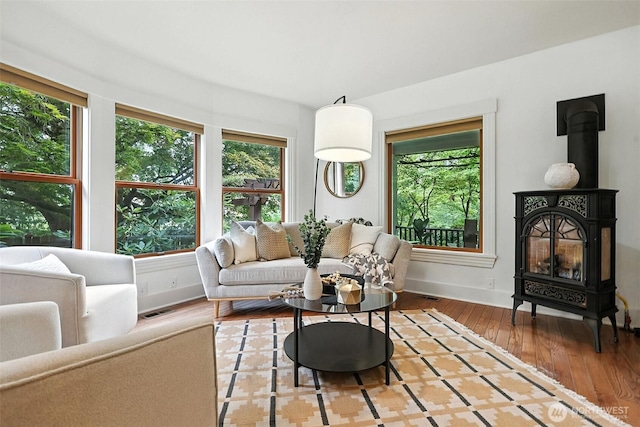 3647 Renton Ave S, Seattle, WA 98144 - living room featuring a wood stove and wood finished floors