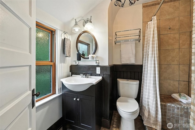 3647 Renton Ave S, Seattle, WA 98144 - bathroom with vanity, tiled shower, and a wainscoted wall