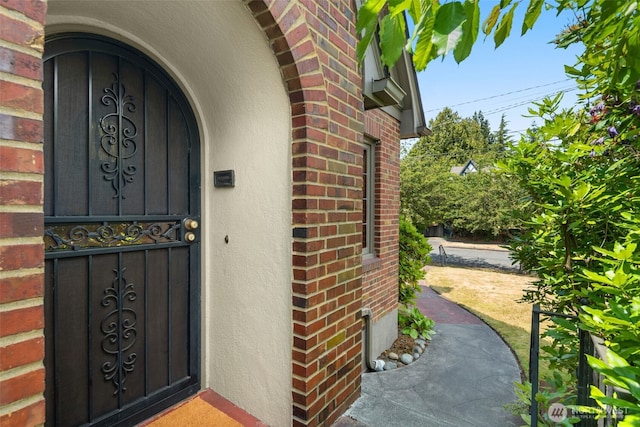 1157 N 78th St, Seattle, WA 98103 - doorway to property with brick siding and stucco siding