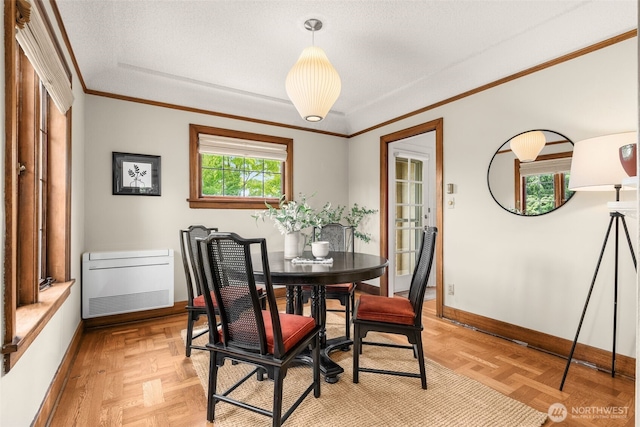 1157 N 78th St, Seattle, WA 98103 - dining room featuring crown molding and heating unit