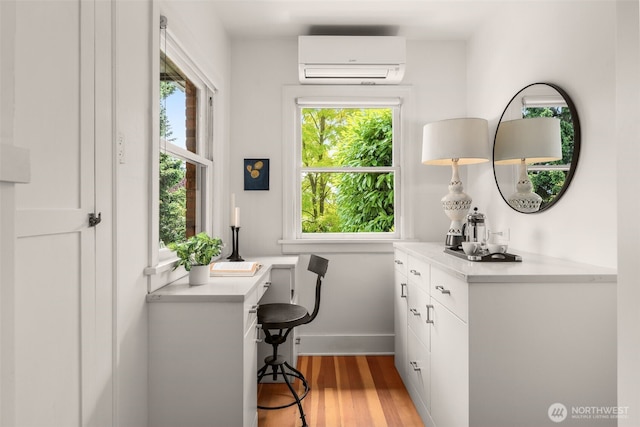 1157 N 78th St, Seattle, WA 98103 - office space featuring an AC wall unit, healthy amount of natural light, and light wood finished floors
