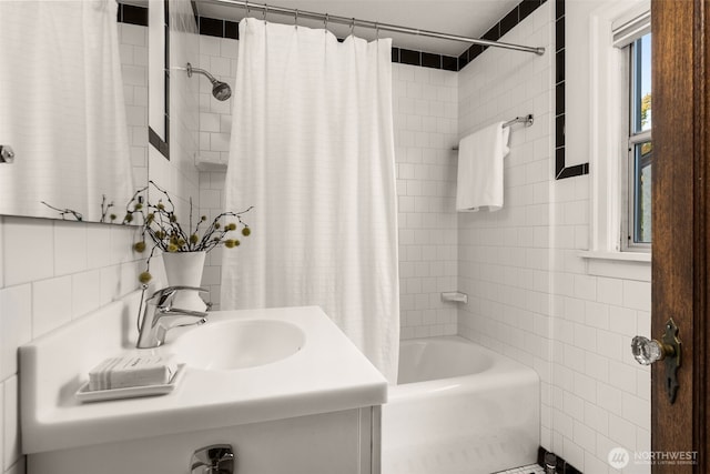 1157 N 78th St, Seattle, WA 98103 - bathroom with tile walls, shower / bathtub combination with curtain, and vanity