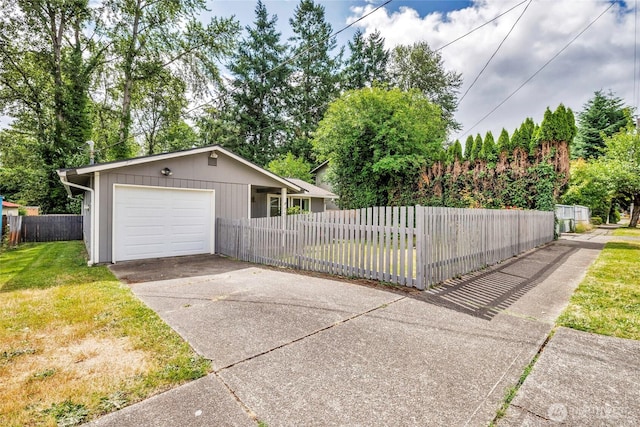7509 E F St, Tacoma, WA 98404 - view of front facade featuring concrete driveway and an attached garage