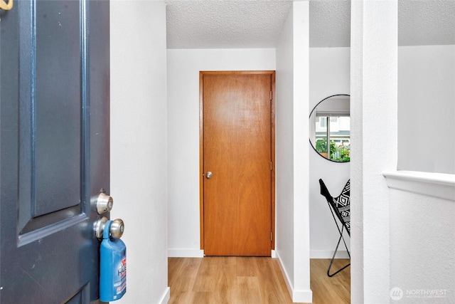 7509 E F St, Tacoma, WA 98404 - entryway with wood finished floors and a textured ceiling