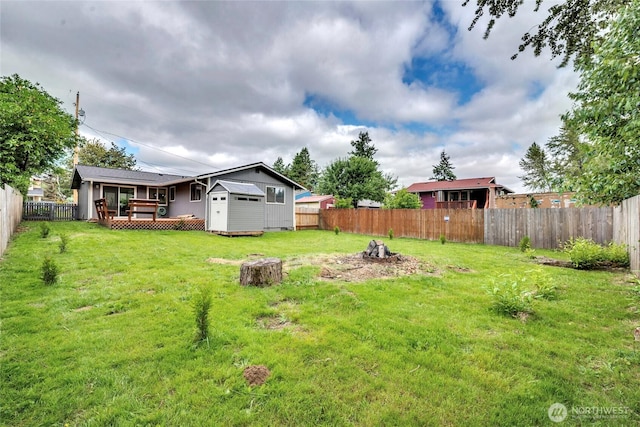 7509 E F St, Tacoma, WA 98404 - fenced backyard featuring a storage shed and a deck