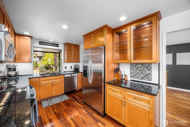 8717 182nd Pl SW, Edmonds, WA 98026 - kitchen with stainless steel appliances, dark wood-style flooring, glass insert cabinets, recessed lighting, and brown cabinets