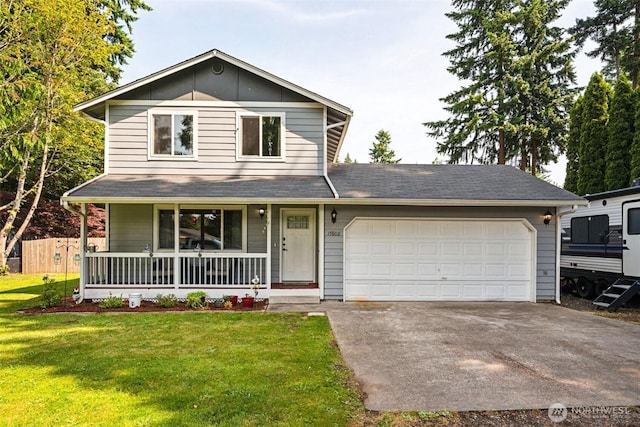 17602 154th Way SE, Yelm, WA 98597 - traditional-style house featuring covered porch, a front lawn, driveway, and an attached garage