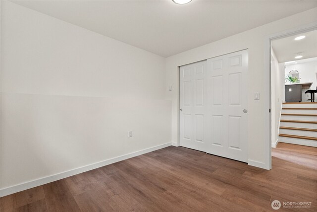 754 SW Oak Rd, Port Orchard, WA 98367 - unfurnished bedroom featuring wood finished floors and a closet
