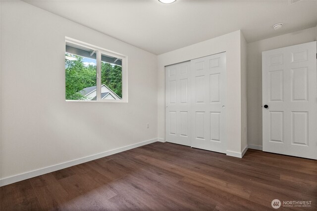 754 SW Oak Rd, Port Orchard, WA 98367 - unfurnished bedroom with dark wood finished floors and a closet