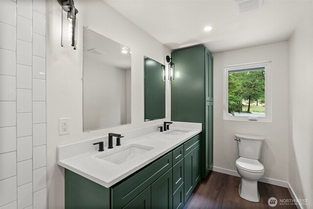 754 SW Oak Rd, Port Orchard, WA 98367 - bathroom featuring double vanity and wood finished floors
