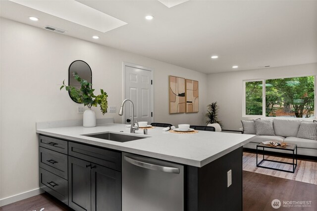 754 SW Oak Rd, Port Orchard, WA 98367 - kitchen featuring stainless steel dishwasher, dark wood-style flooring, light countertops, open floor plan, and recessed lighting