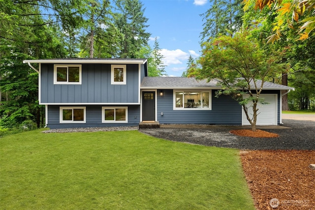 754 SW Oak Rd, Port Orchard, WA 98367 - split level home with an attached garage, a front lawn, board and batten siding, and gravel driveway