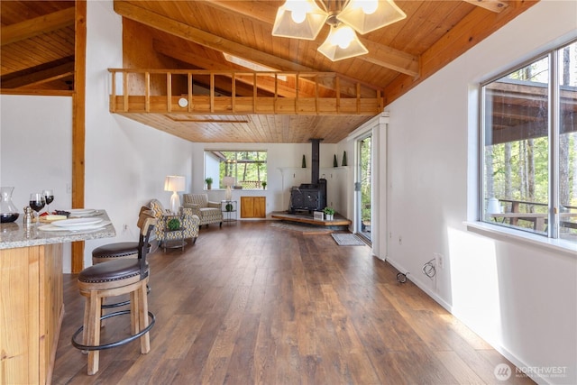 1681 E Saint Andrews Dr N, Shelton, WA 98584 - living room featuring wooden ceiling, a wood stove, hardwood / wood-style floors, and ceiling fan