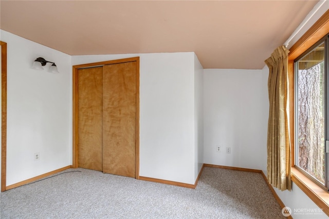 1681 E Saint Andrews Dr N, Shelton, WA 98584 - unfurnished bedroom featuring multiple windows, carpet, and a closet