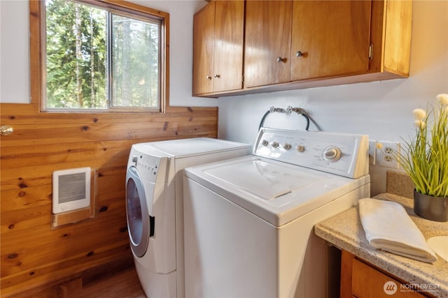 1681 E Saint Andrews Dr N, Shelton, WA 98584 - laundry area with separate washer and dryer, cabinet space, heating unit, and wood walls