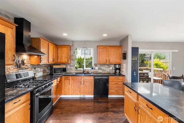 2954 Lowren Loop, Port Orchard, WA 98366 - kitchen featuring appliances with stainless steel finishes, wall chimney range hood, healthy amount of natural light, dark wood-type flooring, and recessed lighting
