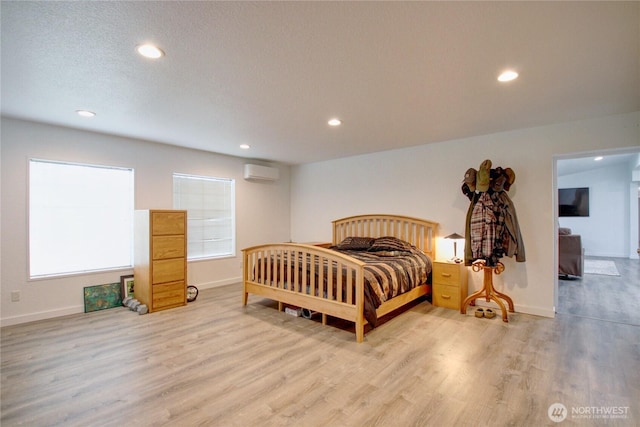 7493 State Route 9, Sedro Woolley, WA 98284 - bedroom with a wall unit AC, wood finished floors, and recessed lighting