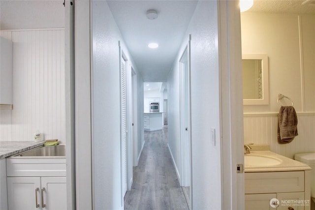 7493 State Route 9, Sedro Woolley, WA 98284 - hall with light wood-style flooring and a sink