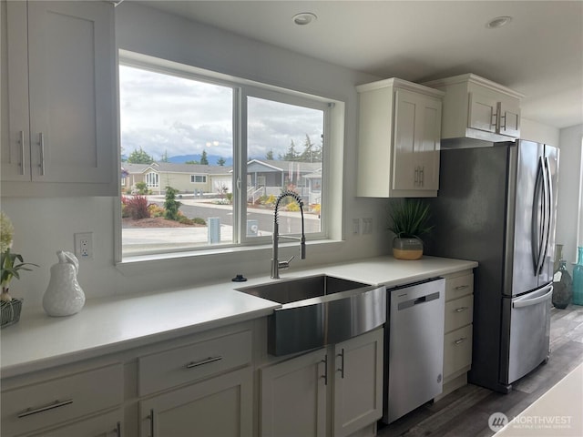 926 N Rock Rose Ave, Sequim, WA 98382 - kitchen with stainless steel appliances, light countertops, wood finished floors, white cabinets, and recessed lighting