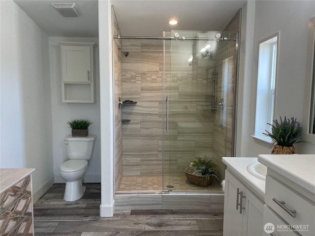 926 N Rock Rose Ave, Sequim, WA 98382 - full bathroom featuring vanity, a shower stall, and wood finished floors
