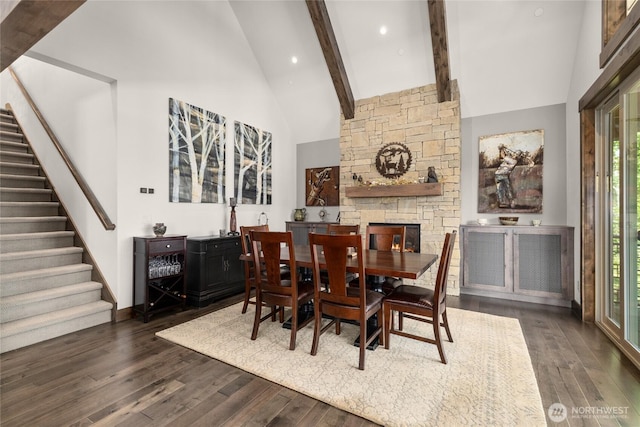 151 Miners Camp Way, Cle Elum, WA 98922 - dining room with stairs, dark wood finished floors, high vaulted ceiling, healthy amount of natural light, and a fireplace