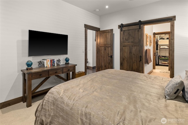 151 Miners Camp Way, Cle Elum, WA 98922 - bedroom featuring a barn door, carpet, a spacious closet, and recessed lighting