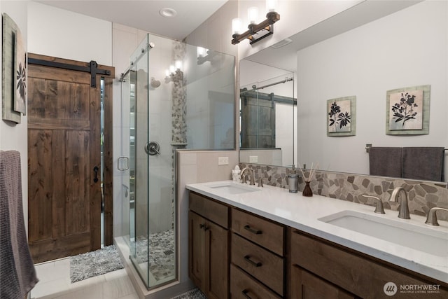 151 Miners Camp Way, Cle Elum, WA 98922 - bathroom featuring double vanity, a stall shower, and tasteful backsplash
