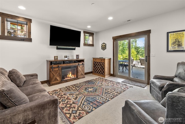 151 Miners Camp Way, Cle Elum, WA 98922 - living room with recessed lighting, light colored carpet, and a glass covered fireplace