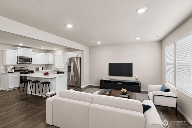 14908 204th Ave E Unit 638, Bonney Lake, WA 98391 - living room featuring dark wood-style floors and recessed lighting