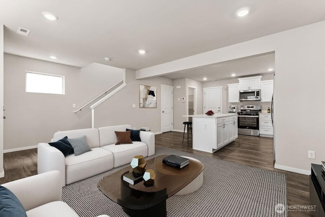 14908 204th Ave E Unit 638, Bonney Lake, WA 98391 - living area featuring dark wood-style floors and recessed lighting