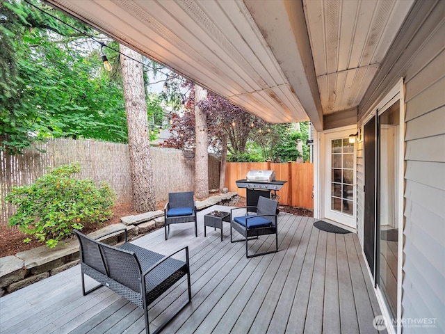 2218 S 336th St Unit 604, Federal Way, WA 98003 - deck with a fenced backyard, outdoor lounge area, and area for grilling