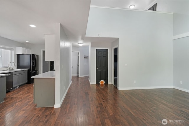 1407 196th St E, Spanaway, WA 98387 - kitchen with freestanding refrigerator, stainless steel dishwasher, light countertops, dark wood-style flooring, and recessed lighting